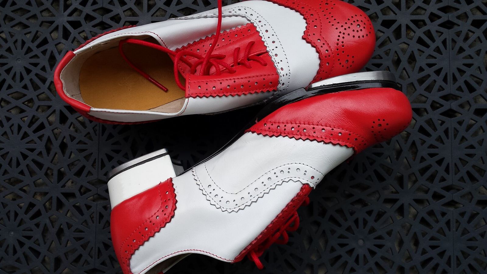 A pair of red and white tap shoes
